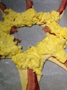 Add softly scrambled eggs and shredded cheese.