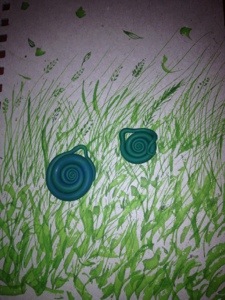 Kid2 is drawing with a calligraphy pen now. Fimo snails. 