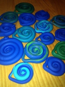 Kid2 is creating an inventory of Fimo swirls for jewelry. One of the many endeavors she launches into. 