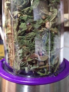 Herbs dried and stacked in the chopper.