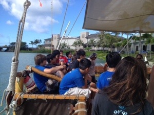 Students learn about the Hokule'a.