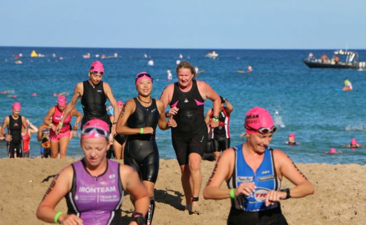Swim to bike transition. See how happy everyone is around me? I just realized my time was slower than last year. 