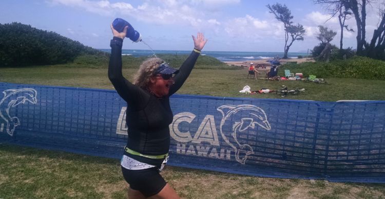 Elated at my finish, pouring water over my head. 