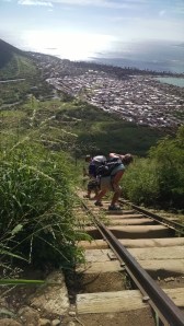A toddler is on dad's back, mom is right behind them, and their little big man raced ahead. It couldn't have been easy. 
