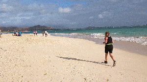 Running across the sand in the final stretch to the finish. 